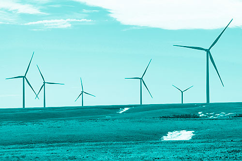 Wind Turbines Scattered Around Melting Snow Patches (Cyan Shade Photo)