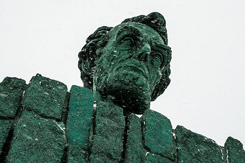 Blowing Snow Across Presidential Statue Head (Cyan Tint Photo)