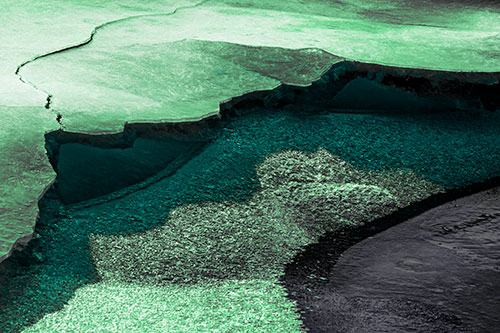 Cracked Ice Frozen Shoreline Melting (Cyan Tint Photo)