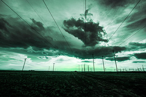 Creature Cloud Formation Above Powerlines (Cyan Tint Photo)