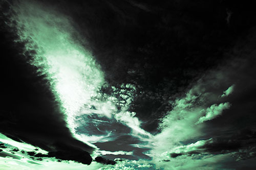 Curving Black Charred Sunset Clouds (Cyan Tint Photo)