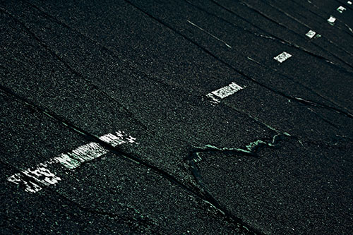 Decomposing Pavement Markings Along Sidewalk (Cyan Tint Photo)