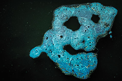 Droopy Smiling Bubble Face Floating Above Soil (Cyan Tint)