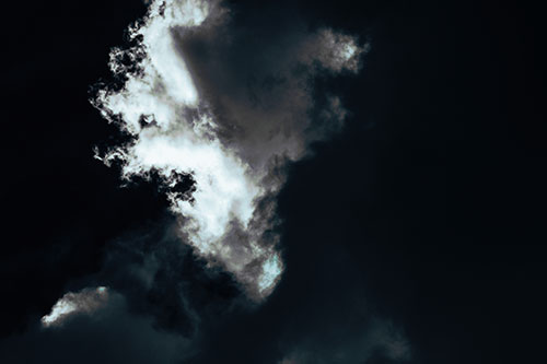 Evil Cloud Face Snarls Among Sky (Cyan Tint Photo)