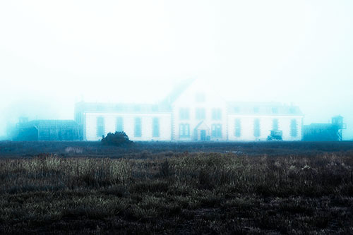 Fog Engulfs Historic State Penitentiary (Cyan Tint Photo)
