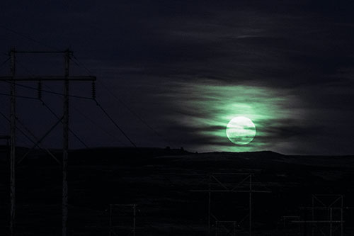 Full Moonrise Behind Mountain (Cyan Tint Photo)