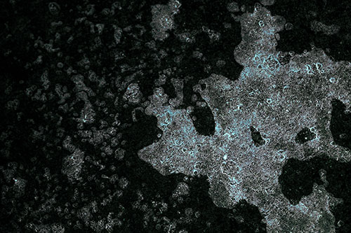 Furious Screaming Ice Face Melting Among Pavement (Cyan Tint)