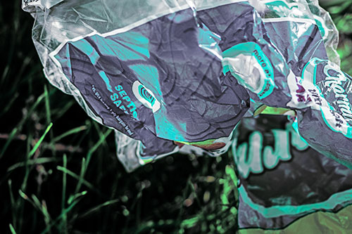 Growling Plastic Charmin Bag Among Grass (Cyan Tint)