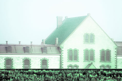 Historic State Penitentiary Oozes Among Fog (Cyan Tint Photo)