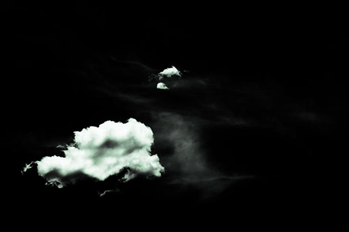 Isolated Creature Head Cloud Appears Within Darkness (Cyan Tint Photo)