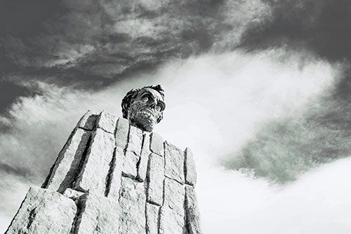Presidents Statue Standing Tall Among Clouds (Cyan Tint Photo)