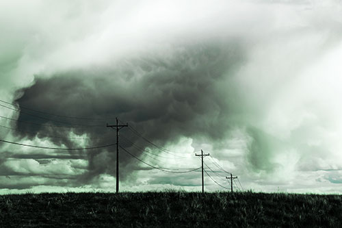 Rainstorm Clouds Twirl Beyond Powerlines (Cyan Tint Photo)