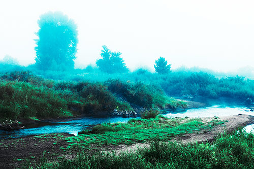 River Flowing Along Foggy Vegetation (Cyan Tint Photo)