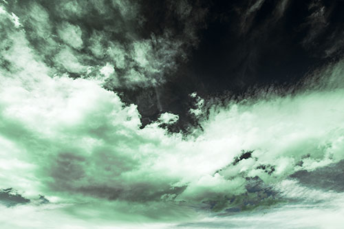 Sunset Illuminating Large Cloud Mass (Cyan Tint)