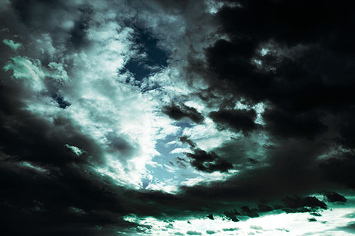 Thick Dark Cloud Refuses To Split In Half (Cyan Tint Photo)