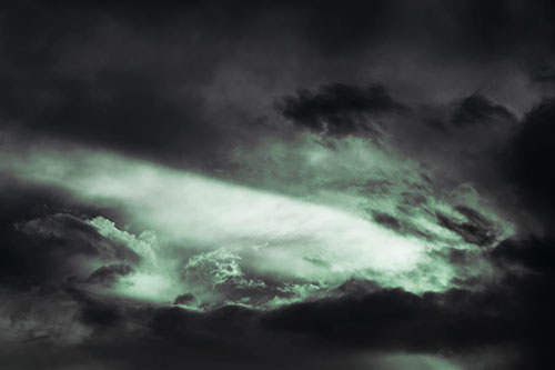White Light Tearing Through Clouds (Cyan Tint Photo)