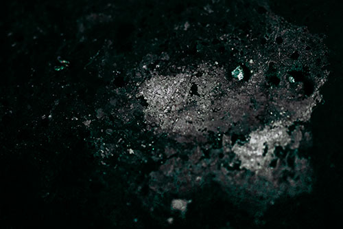 Wide Eyed Oil Demon Face Floating Atop Water (Cyan Tint)