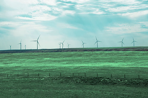Wind Turbines Scattered Along The Prairie Horizon (Cyan Tint Photo)