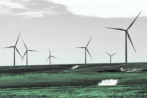 Wind Turbines Scattered Around Melting Snow Patches (Cyan Tint Photo)