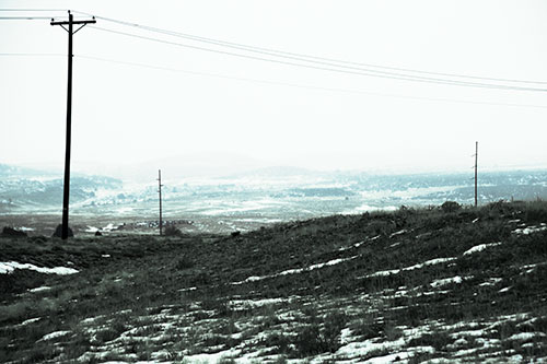 Winter Snowstorm Approaching Powerlines (Cyan Tint Photo)