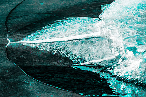 Abstract Ice Sculpture Forms Atop Frozen River (Cyan Tone Photo)