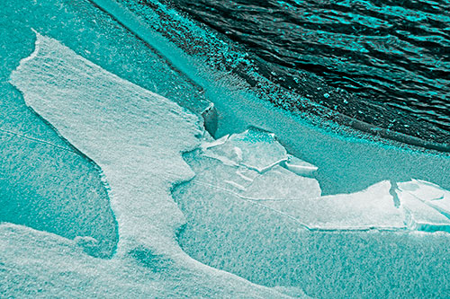 Broken Cracked Ice Along Shoreline (Cyan Tone Photo)