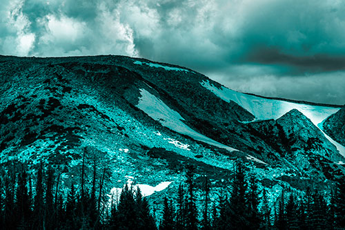 Clouds Cover Melted Snowy Mountain Range (Cyan Tone Photo)
