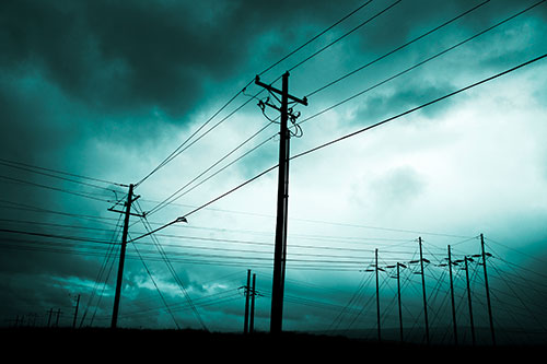 Crossing Powerlines Beneath Rainstorm (Cyan Tone Photo)