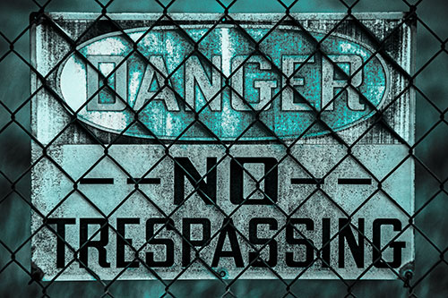 Dirty Danger No Trespassing Sign Behind Chain Link Fence (Cyan Tone)
