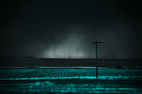 Distant Thunderstorm Rains Down Upon Powerlines (Cyan Tone Photo)