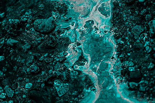 Distorted Oil Face Smearing Among Rocky Shore (Cyan Tone)