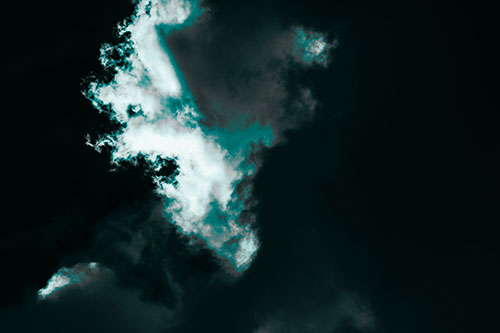 Evil Cloud Face Snarls Among Sky (Cyan Tone Photo)