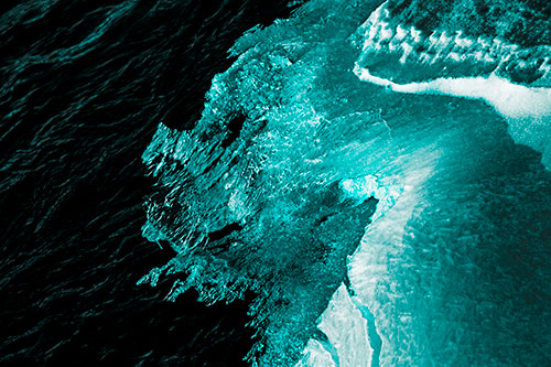 Melting Ice Face Creature Atop River Water (Cyan Tone Photo)