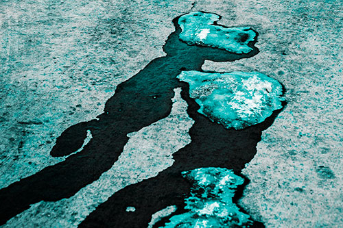Melting Ice Puddles Forming Water Streams (Cyan Tone Photo)