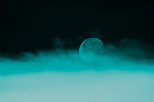 Moon Rolling Along Clouds (Cyan Tone Photo)