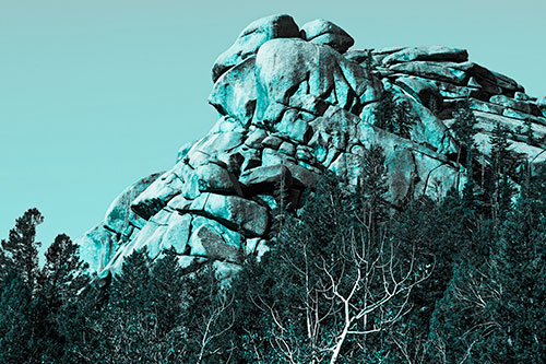 Rock Formations Rising Above Treeline (Cyan Tone Photo)