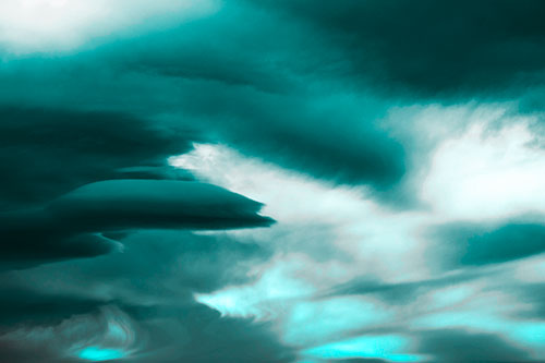Smooth Cloud Sails Along Swirling Formations (Cyan Tone Photo)