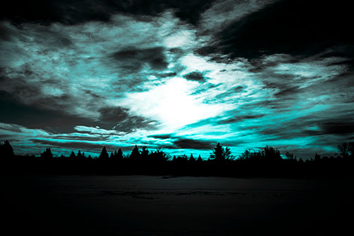 Sun Vortex Illuminates Clouds Above Dark Lit Lake (Cyan Tone Photo)