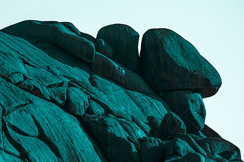 Sunlight Casting Shadows On Mountain Of Rocks (Cyan Tone)