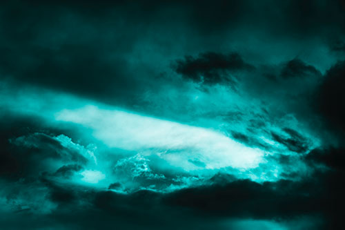 White Light Tearing Through Clouds (Cyan Tone Photo)