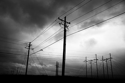 Crossing Powerlines Beneath Rainstorm (Gray Photo)