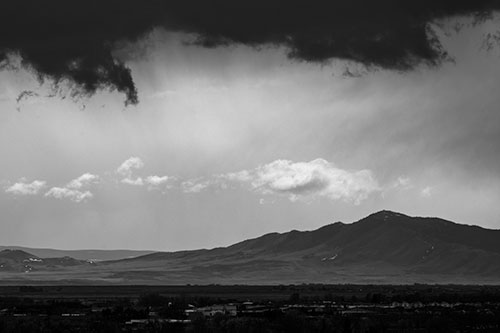 Dark Cloud Mass Above Mountain Range Horizon (Gray Photo)