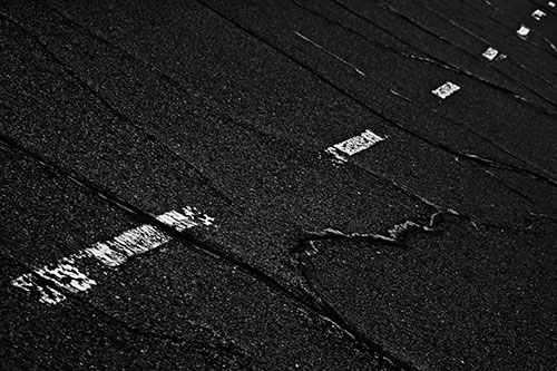 Decomposing Pavement Markings Along Sidewalk (Gray Photo)