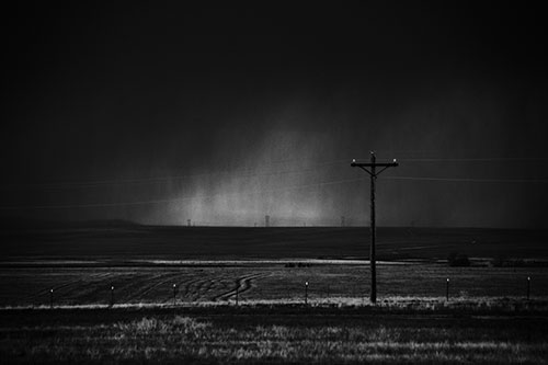 Distant Thunderstorm Rains Down Upon Powerlines (Gray Photo)