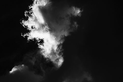 Evil Cloud Face Snarls Among Sky (Gray Photo)