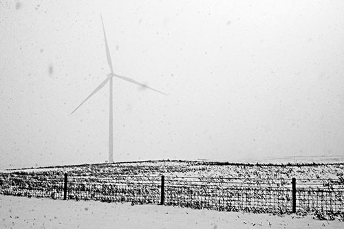 Fenced Wind Turbine Among Blowing Snow (Gray)
