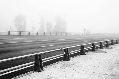 Fog Surrounds Deserted Sidewalk Roadway (Gray Photo)