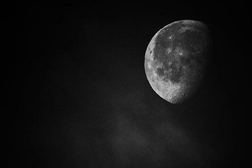 Moon Creeping Along Faint Cloud Mass (Gray Photo)