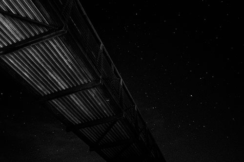 Stars Shining Above Walkway Bridge (Gray Photo)
