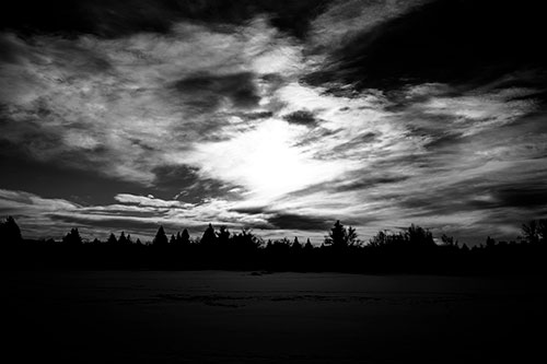 Sun Vortex Illuminates Clouds Above Dark Lit Lake (Gray Photo)